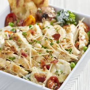 a dish of pasta and vegetables