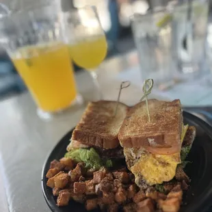 Margarita pitcher in the back. BELT sandwich with seasoned breakfast potatoes.