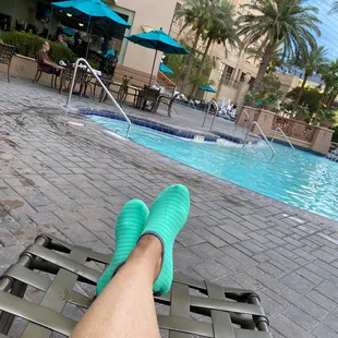 a person's feet in green socks