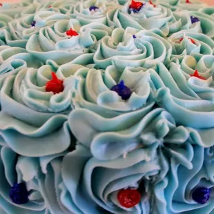 a cake with blue frosting