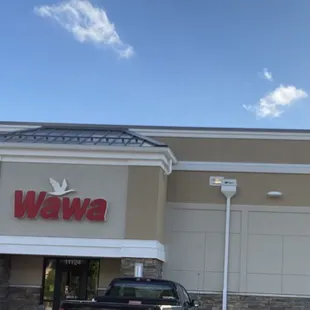 a pickup truck parked in front of a wawa restaurant