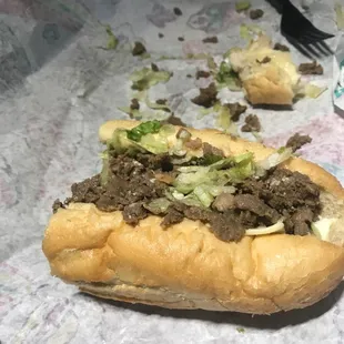 a half eaten sandwich on a table