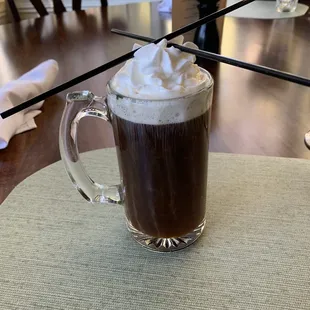 a cup of coffee with whipped cream