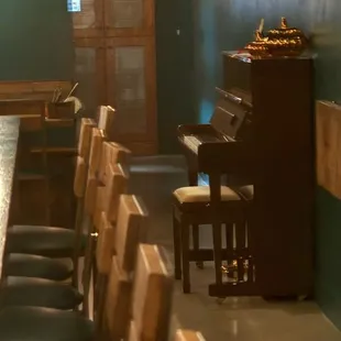 The piano! Great ambience for the whole space.