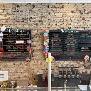 menus on a brick wall