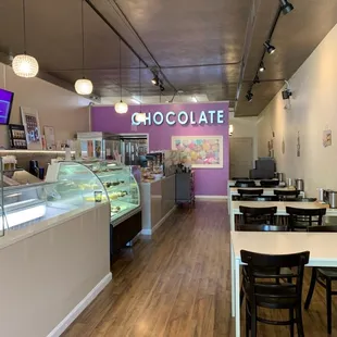 Seating on the side and the counter with chocolate and snacks