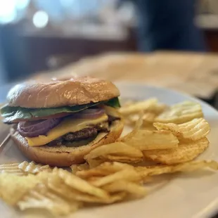 a hamburger and chips on a plate