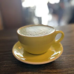a cup of coffee on a saucer