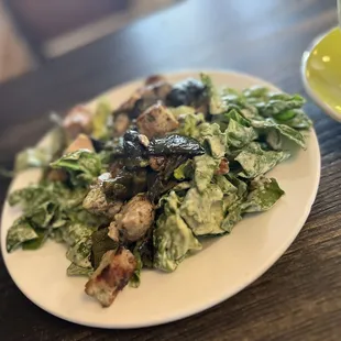 a plate of salad and a cup of coffee