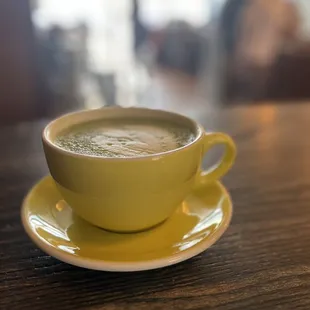 a cup of coffee on a saucer