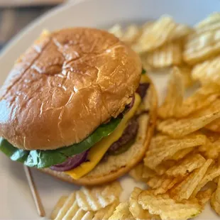 a hamburger and chips on a plate