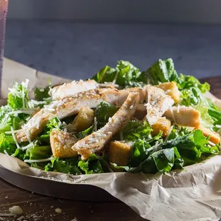 a salad with chicken and lettuce