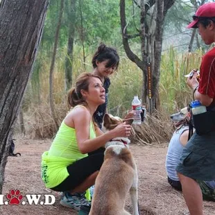Guide Eve doing her part and helping to Give Water to the Oahu SPCA dogs at the Summit.