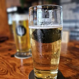 a pint of beer on a table
