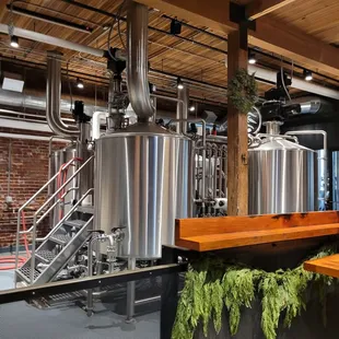 a row of stainless steel tanks