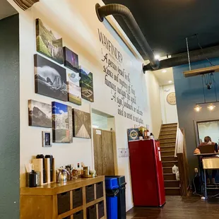 a coffee shop with a red refrigerator