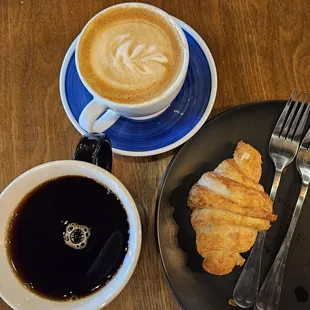 Cappuccino, black coffee, and chocolate croissant