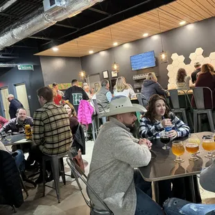 a large group of people sitting at tables