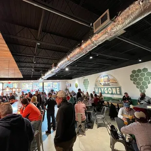 a large group of people sitting at tables