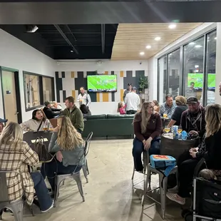 a group of people sitting around a table
