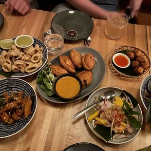 Curry puff, mango shrimp salad, wanton rolls, duck salad, wings, avocado Pla Muk Tod (Fried Calamari)