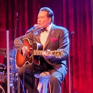 Wayne playing guitar