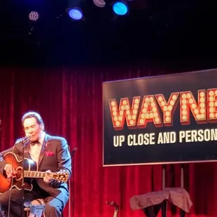 Wayne playing guitar