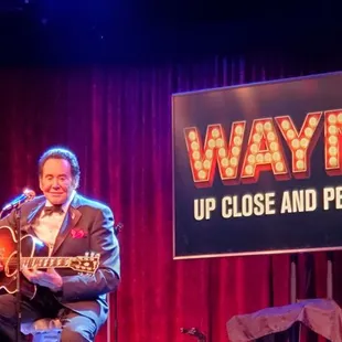 Wayne playing guitar