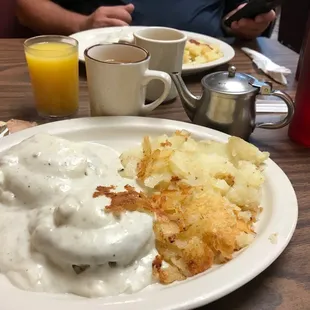 a plate of food and a glass of orange juice