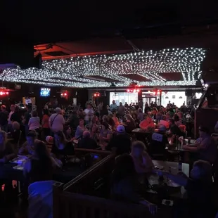 a crowd of people sitting at tables