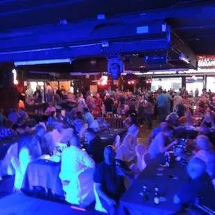 a crowd of people sitting at tables