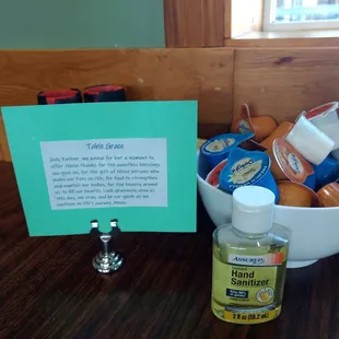 Table Grace on every table along with sanitizer, mixed creamers and salt and pepper grinders.