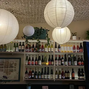 a variety of wine bottles on a shelf