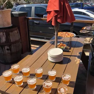 Wood-fired pizza and locally brewed beer samples.