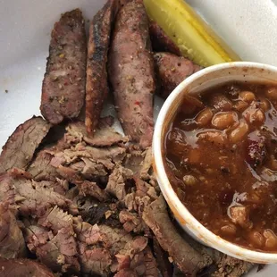 Carry out - some of the sausage and beef that came with the Super We-B platter for two (I ate a little before I took the pic), and beans