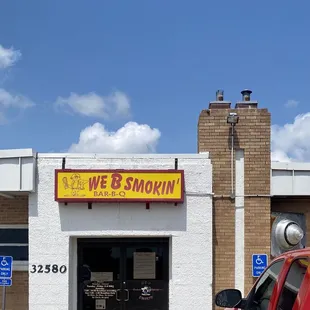  a red truck parked in front of a store