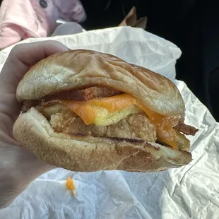 Vegan breakfast sandwich with just egg, a brioche bun, cheddar cheese, and bacon