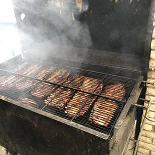 smoke coming out of a grill
