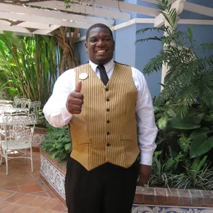 Meet "Curtis, the Butler"; his most frevent hope is to make your vacation "amazing".
