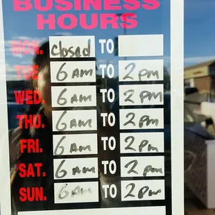 a business hours sign