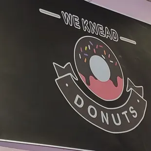 a sign for a donut shop