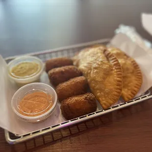 Empanadas and croquetas with sauces