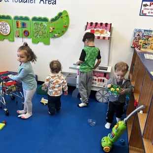 Toddler area. Shopping cart, doctors office, ice cream stand, Melissa and Doug grocery checkout. Dress up! And so much more!