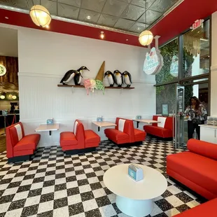 the interior of a diner with a checkered floor