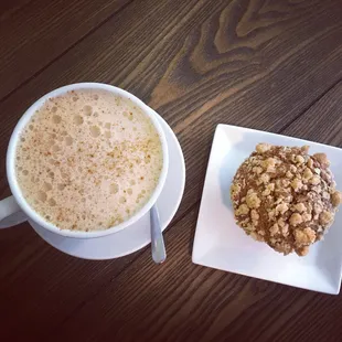 Seasonal steamed apple cider topped with cinnamon and pumpkin streusel muffin