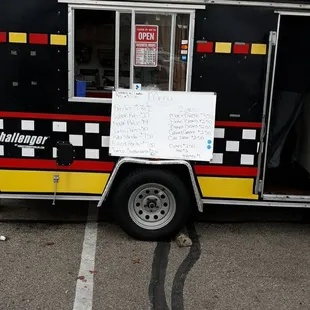  a food truck parked in a parking lot