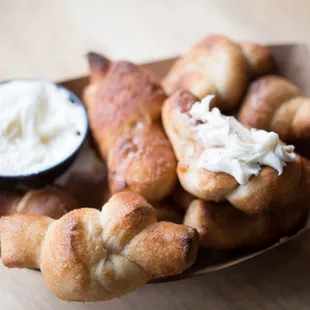 a basket of breadsticks and dip