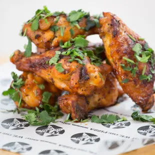 a pile of chicken wings