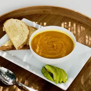 a bowl of soup and bread