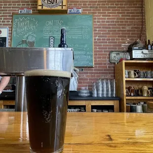 a pint of beer on the bar